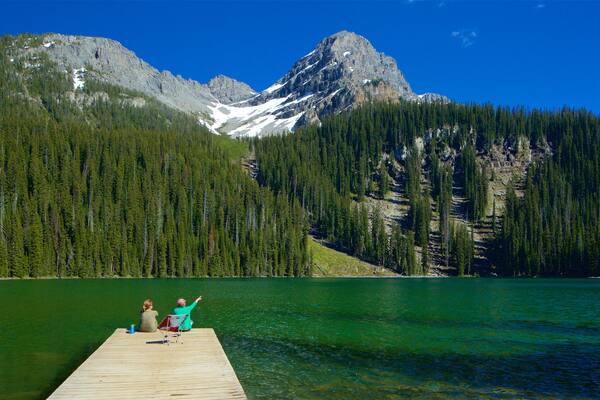 Top of the World Provincial Park featuring a lake or waterhole and tranquil scenes as well as a couple