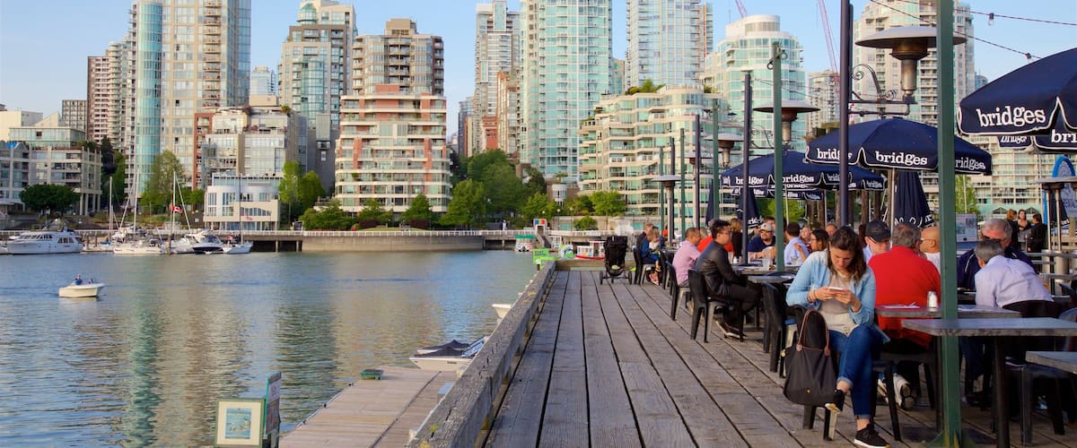 Granville Island showing a bay or harbor, outdoor eating and a city