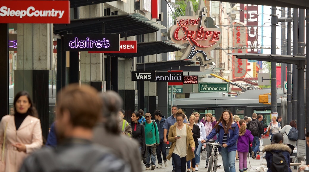 Granville Street presenterar shopping och skyltar såväl som en stor grupp av människor