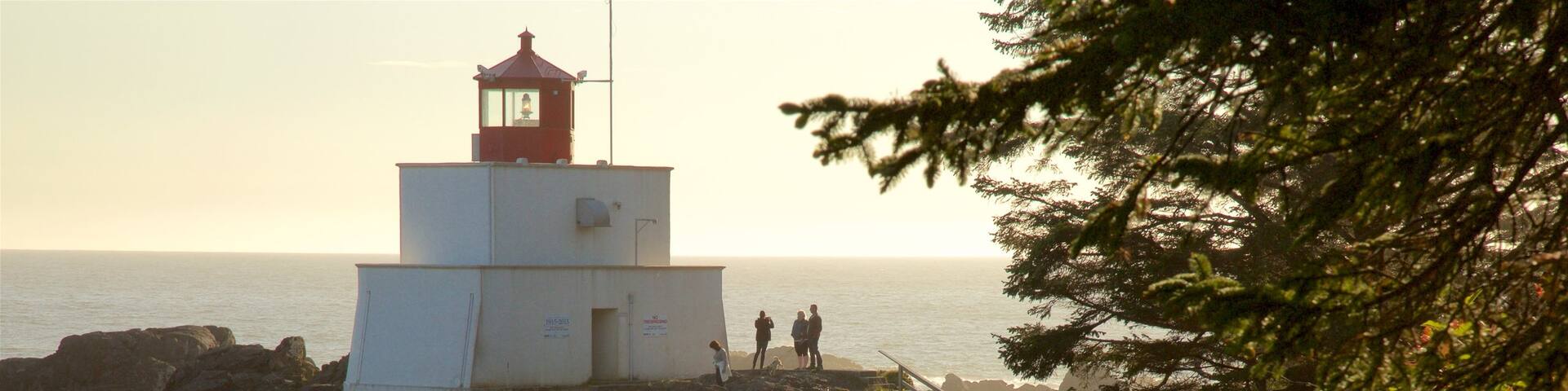 Amphitrite Point Lighthouse which includes general coastal views, a lighthouse and a sunset