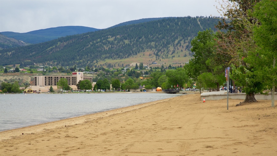 Okanagan Beach showing a small town or village, general coastal views and a beach