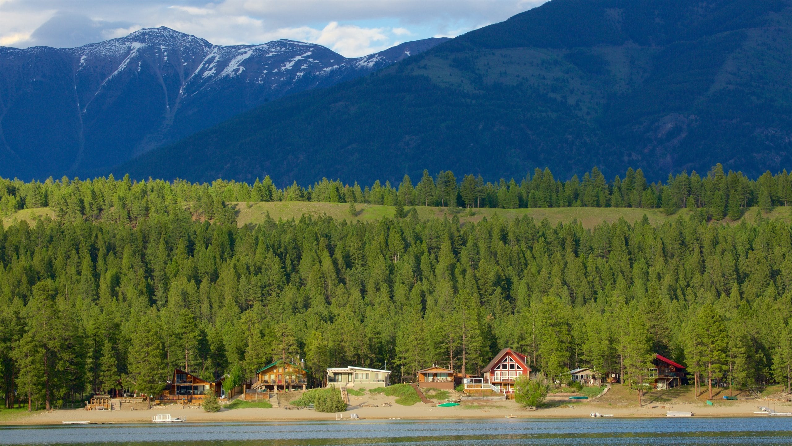 Skookumchuck which includes a lake or waterhole, mountains and tranquil scenes