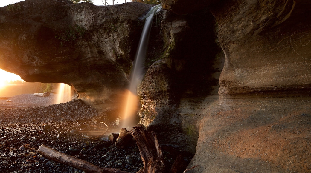 Sooke featuring a sunset, a cascade and a pebble beach