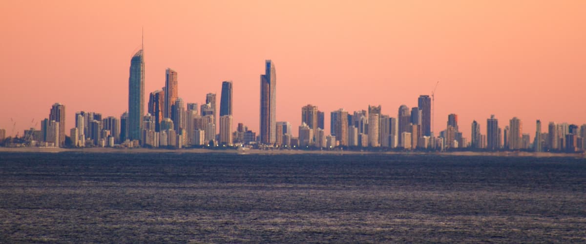 Coolangatta which includes a high-rise building, a sunset and general coastal views