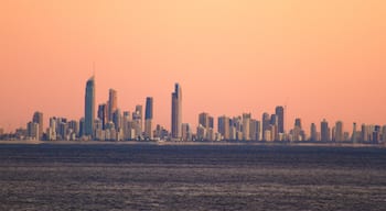 Coolangatta which includes a high rise building, a city and a sunset