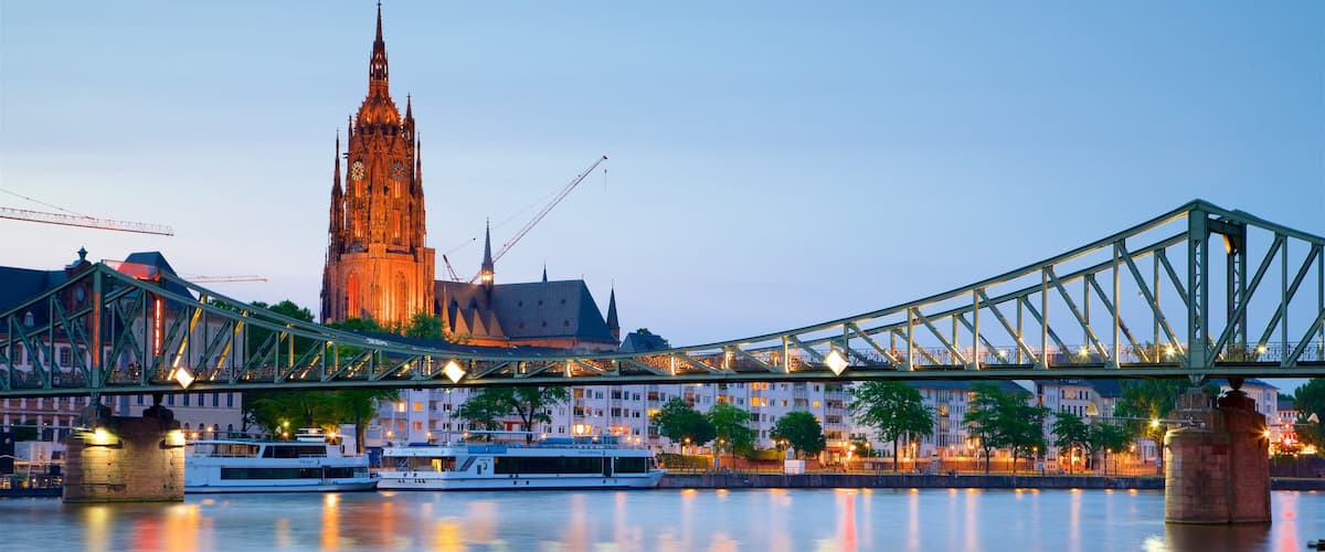 Frankfurt Cathedral featuring a river or creek, heritage elements and a sunset