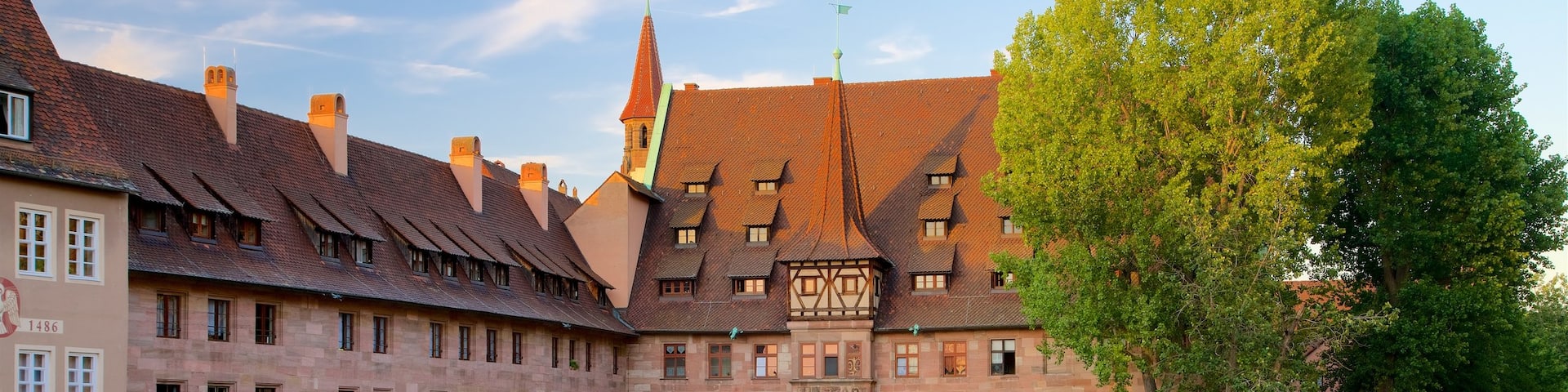 Heilig Geist Spital featuring heritage elements and a river or creek