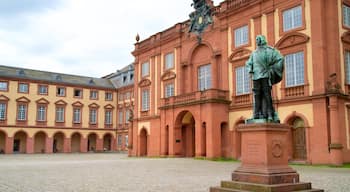 Mannheim Palace which includes heritage elements, a statue or sculpture and a square or plaza