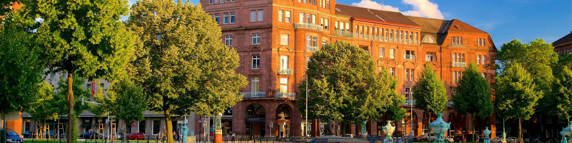 Friedrichsplatz which includes a park, a sunset and heritage elements
