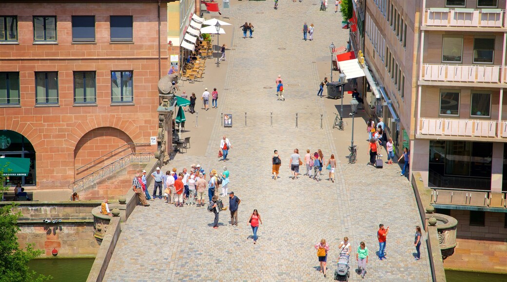 Fleischbrucke showing a bridge as well as a small group of people