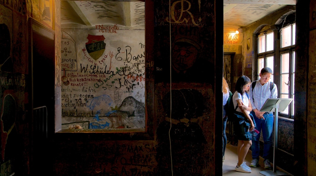 Heidelberg showing interior views and outdoor art as well as a small group of people