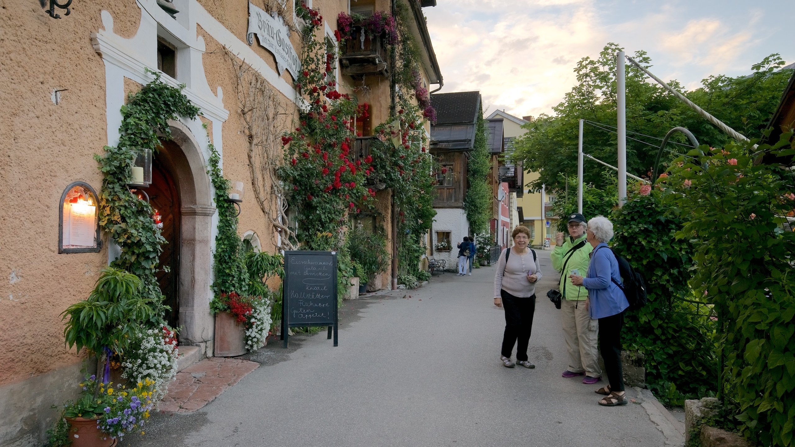 Hallstatt which includes flowers and heritage elements as well as a small group of people