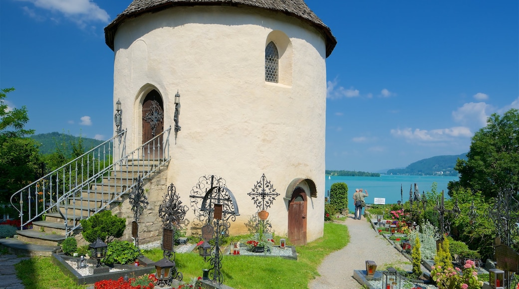 St. Primus and Felician Parish Church showing a cemetery, a lake or waterhole and heritage elements