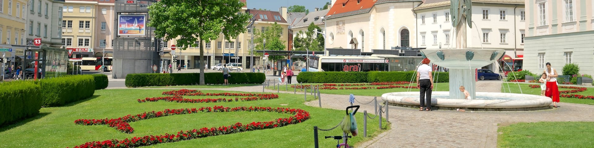 Klagenfurt am Woerthersee featuring heritage elements, a park and a fountain