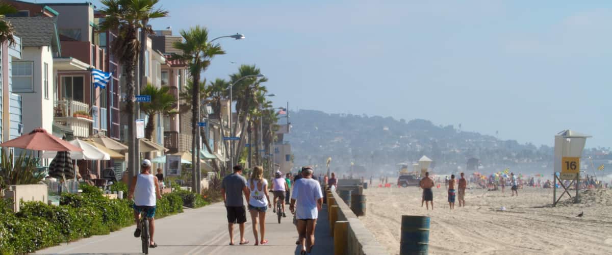 Mission Beach featuring tropical scenes, street scenes and a beach