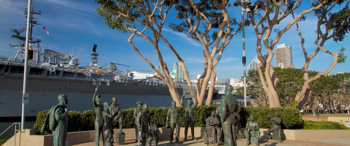 Navy Pier showing a marina, a city and a statue or sculpture