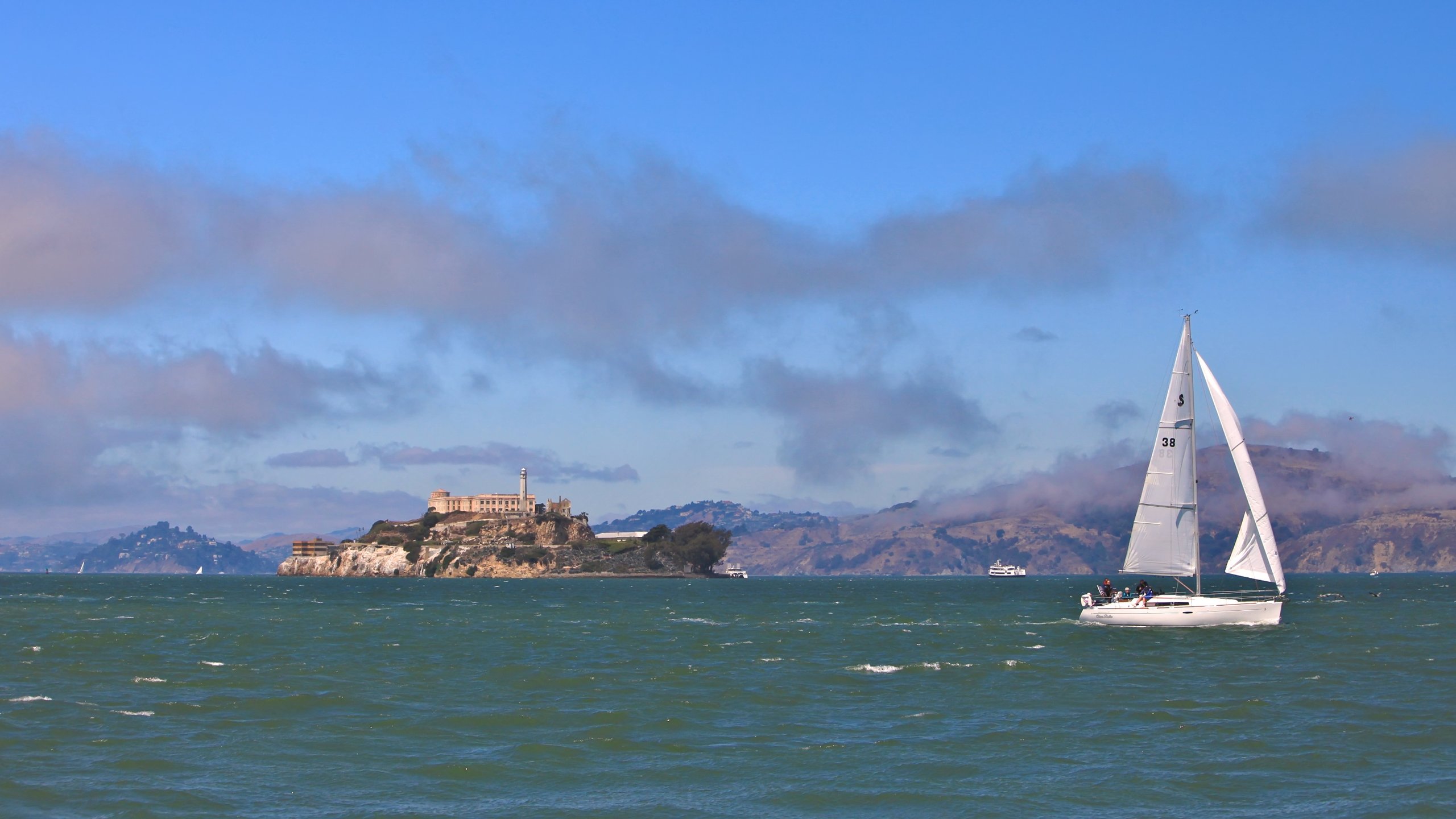 Alcatraz Island which includes skyline, general coastal views and a bay or harbor