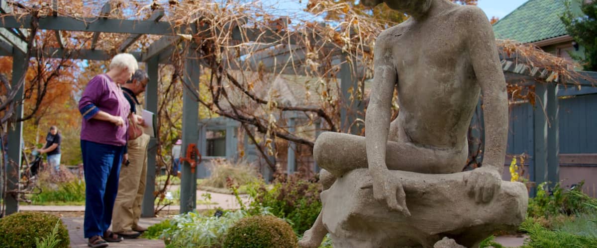 Denver Botanic Gardens featuring a statue or sculpture, a garden and outdoor art