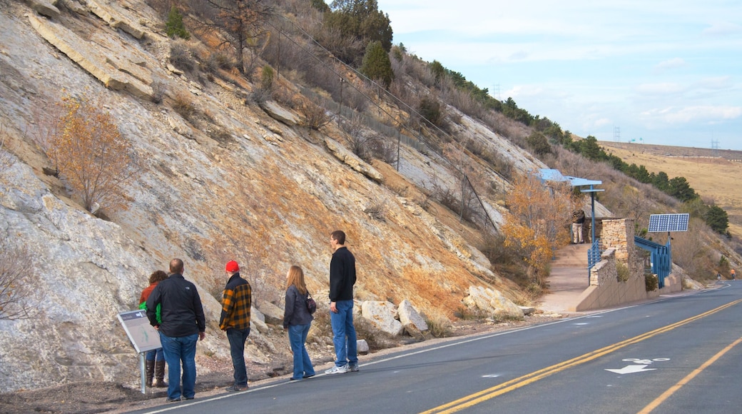 Dinosaur Ridge which includes hiking or walking and landscape views as well as a small group of people