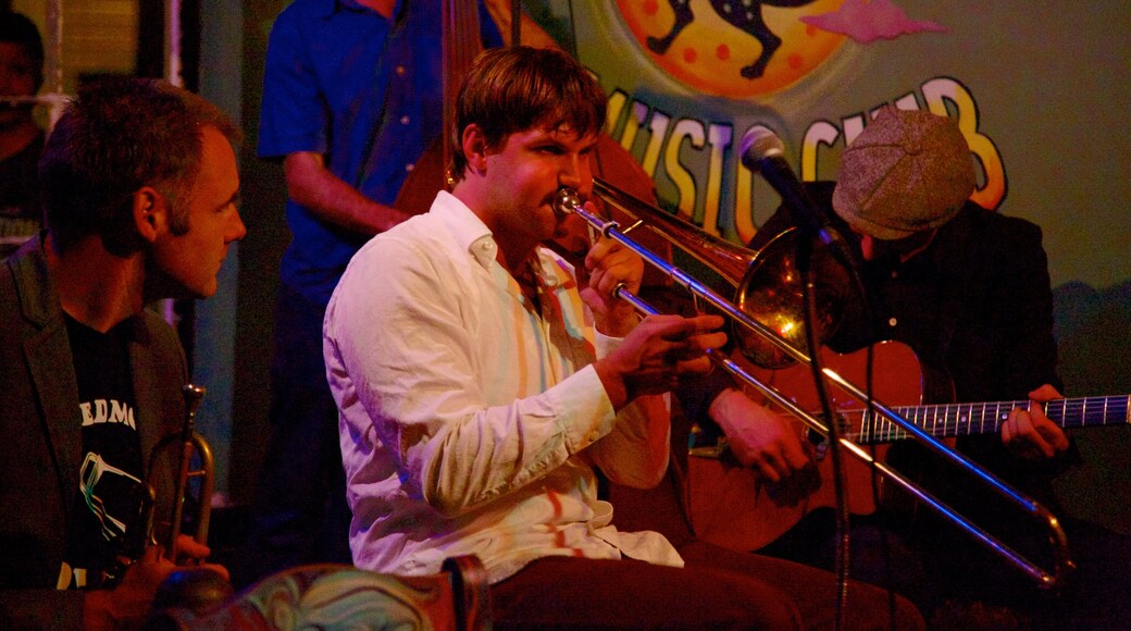 Frenchmen Street Jazz Clubs which includes night scenes, performance art and music