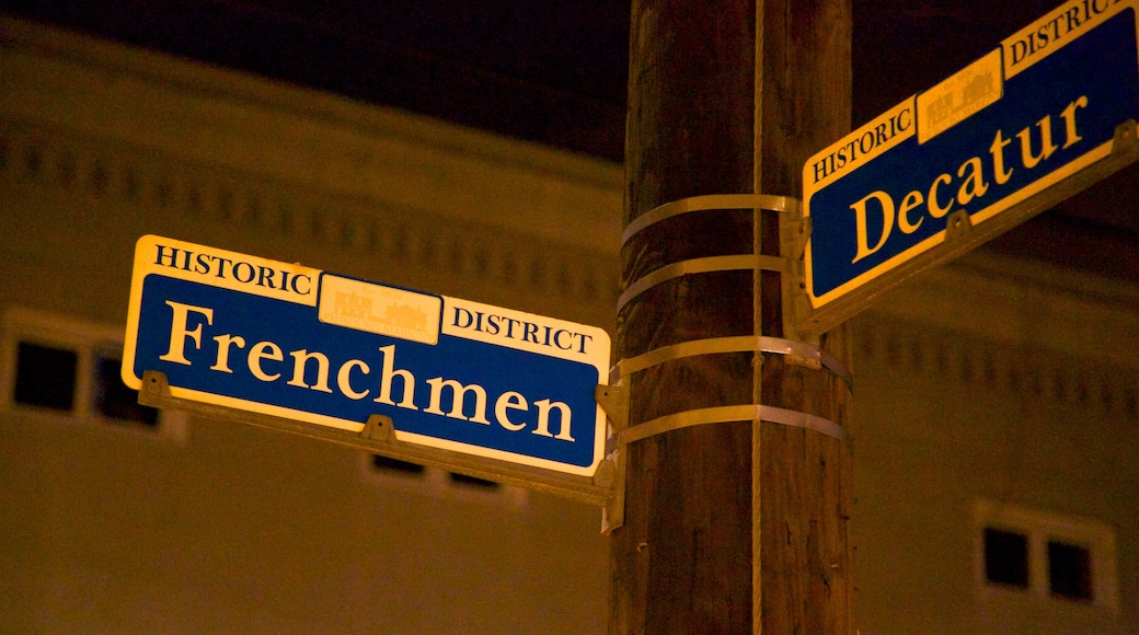 Frenchmen Street Jazz Clubs showing signage, street scenes and a city