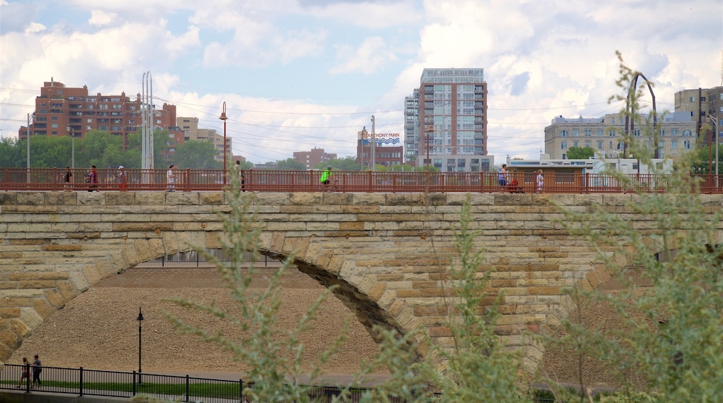 Stone Arch Bridge which includes a city, a bridge and a river or creek