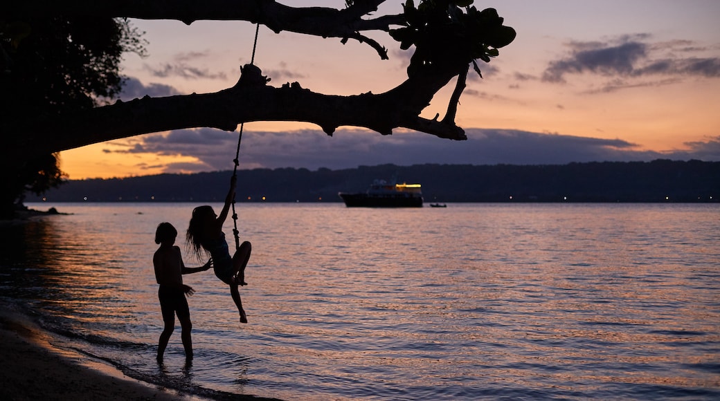 Aore Island featuring general coastal views and a sunset as well as children