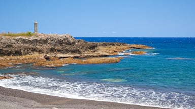 Tanna inclusief een kiezelstrand, ruige kustlijn en algemene kustgezichten