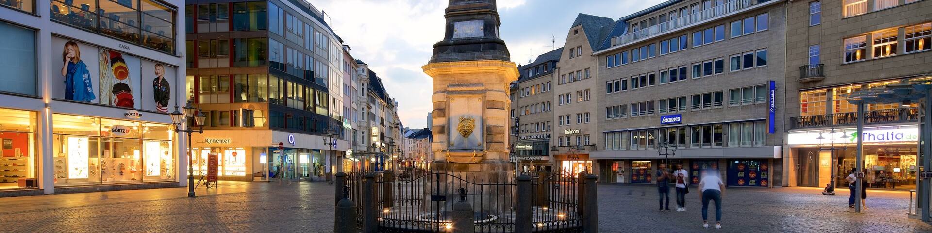 Bonn Marketplace showing a square or plaza and a sunset