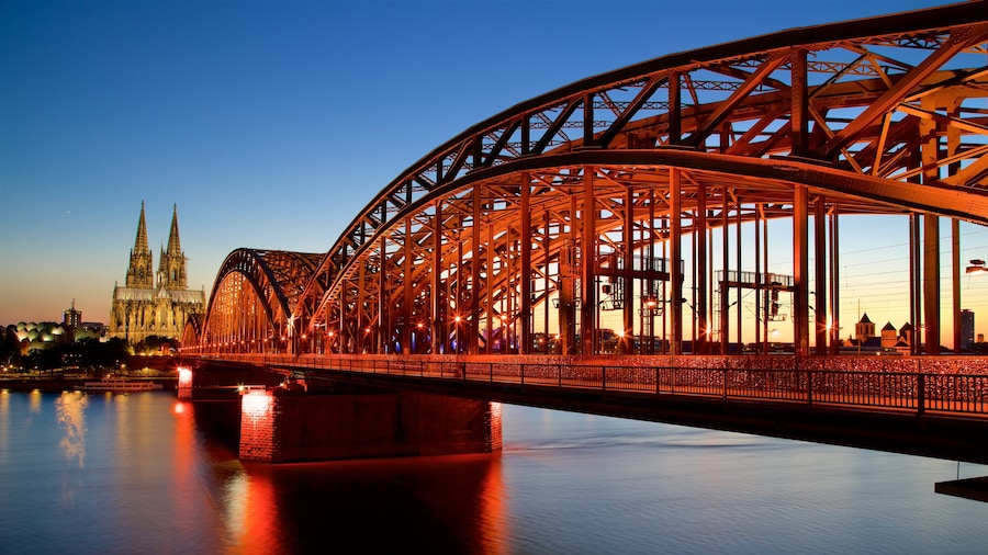 Hohenzollern Bridge showing a bridge, a river or creek and a sunset