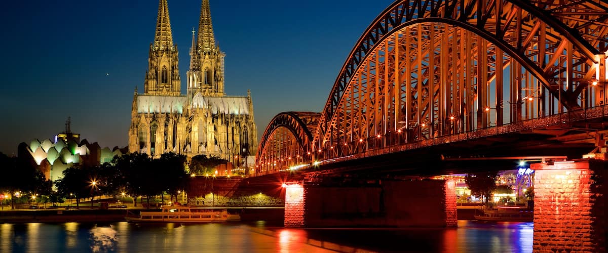 Hohenzollern Bridge which includes a bridge, a church or cathedral and night scenes