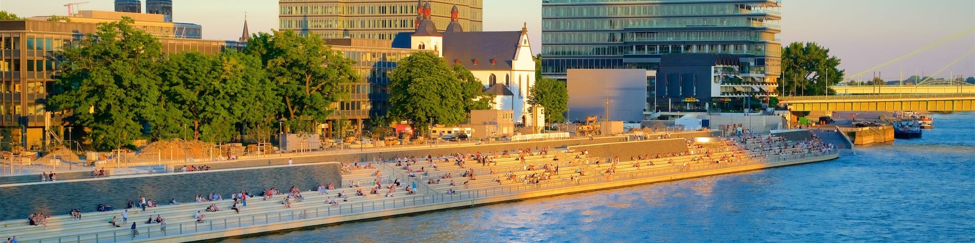 Rheinboulevard showing a river or creek, a city and a sunset