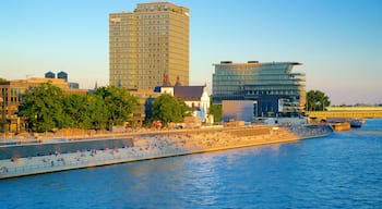 Rheinboulevard showing a river or creek, a city and a sunset