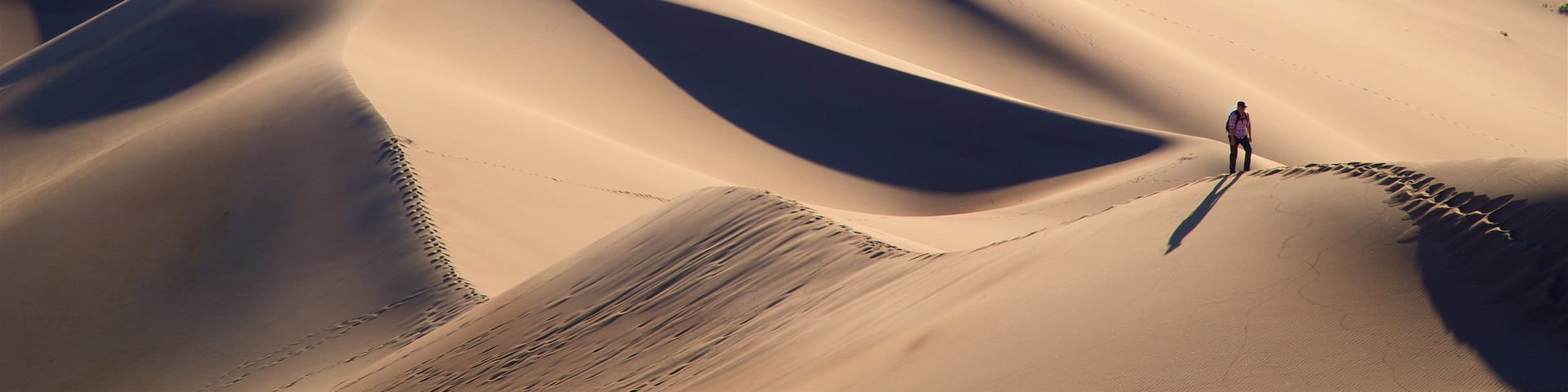Great Sand Dunes National Park which includes desert views, hiking or walking and tranquil scenes