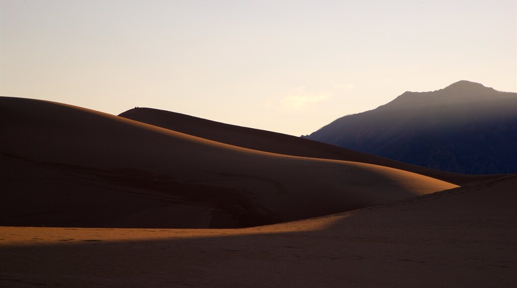 Los Caminos Antiguos which includes desert views and a sunset