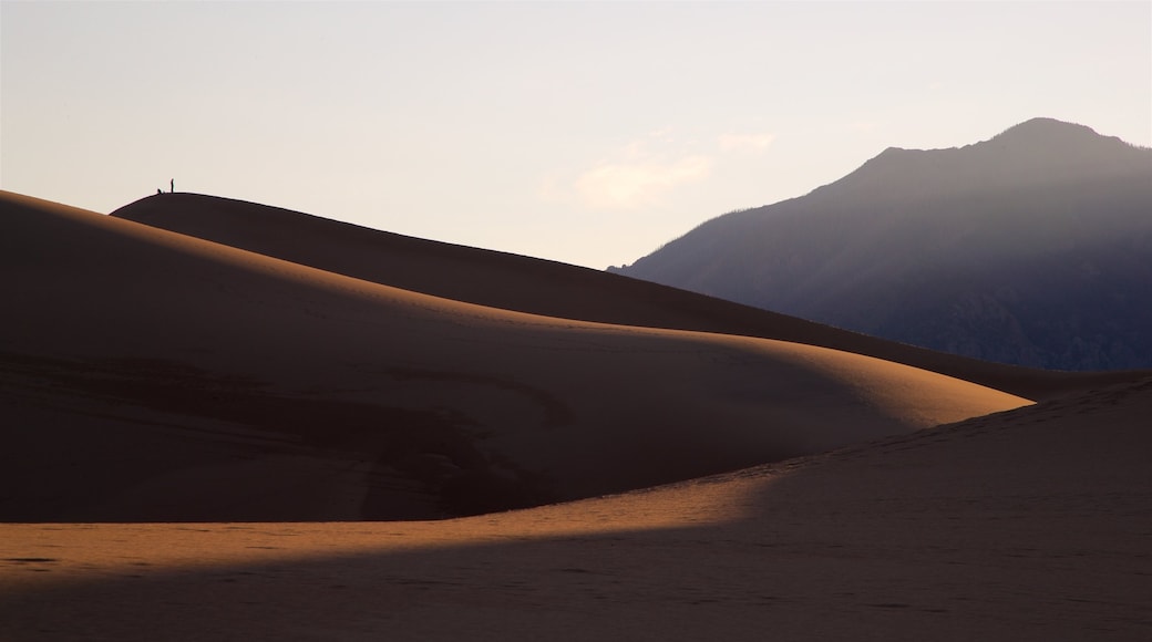 Great Sand Dunes National Park which includes a sunset, landscape views and desert views