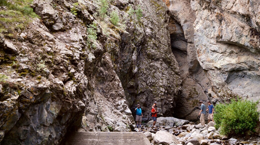 Sangre de Cristo Mountains which includes hiking or walking and a gorge or canyon as well as a small group of people