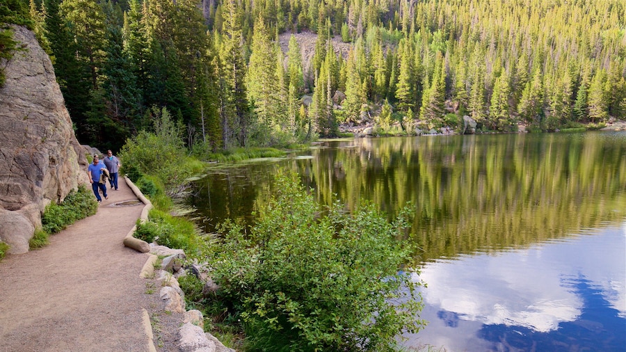 Bear Lake Trailhead featuring a lake or waterhole as well as a small group of people