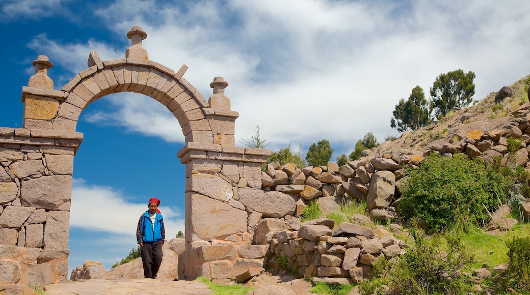 Lake Titicaca featuring heritage elements as well as an individual male