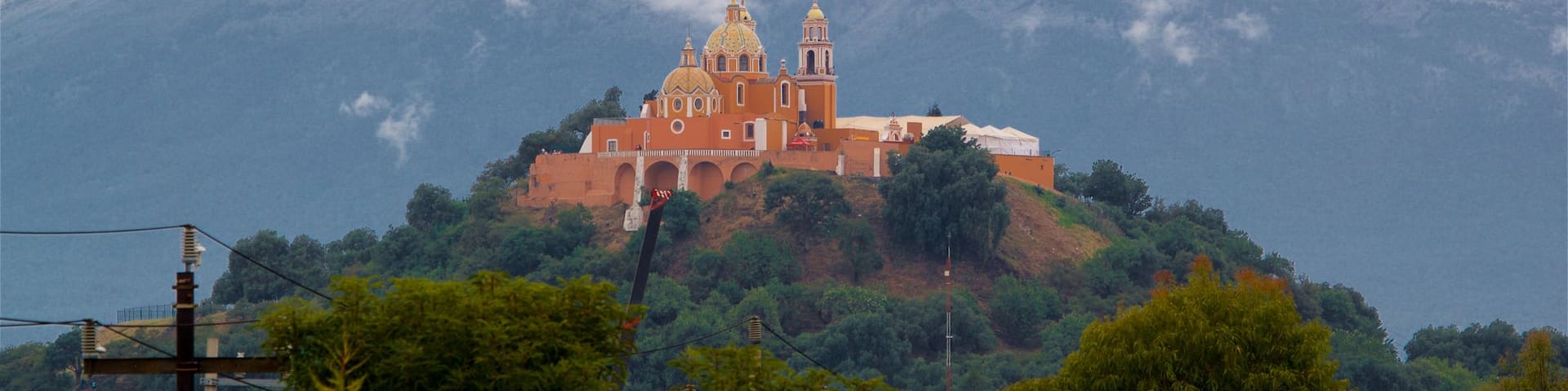 La Virgen de los Remedios Sanctuary featuring tranquil scenes, mountains and mist or fog