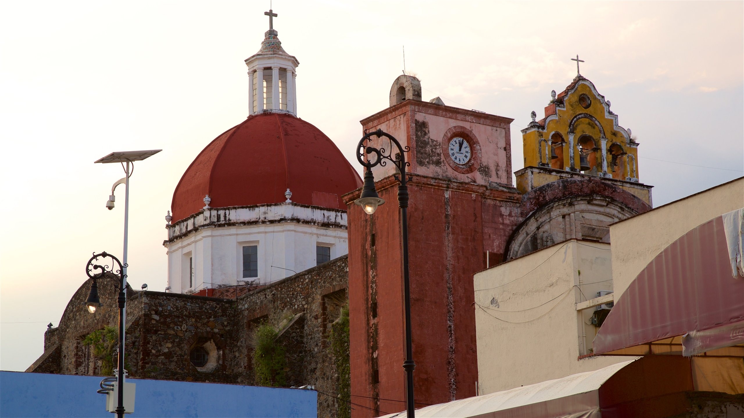 Cuernavaca featuring a church or cathedral, heritage elements and a sunset