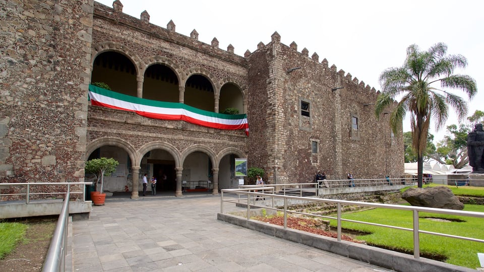 Palace of Cortes Museum showing heritage elements and a garden