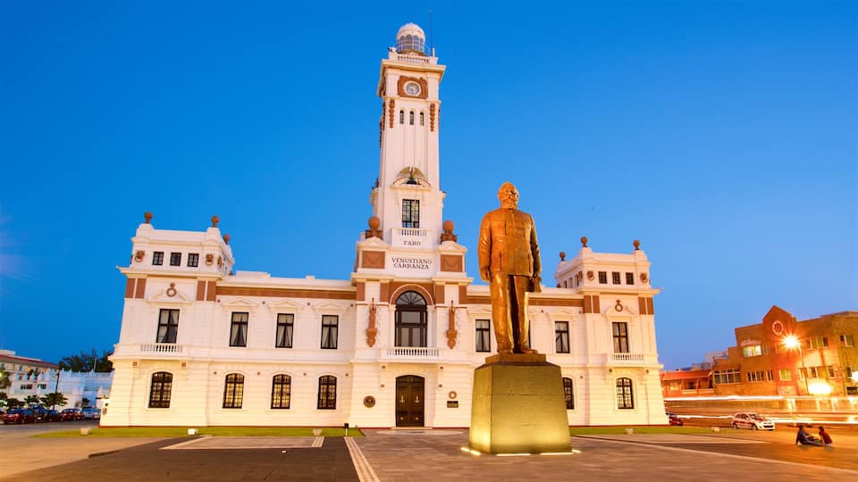 Malecon featuring night scenes, a square or plaza and a statue or sculpture