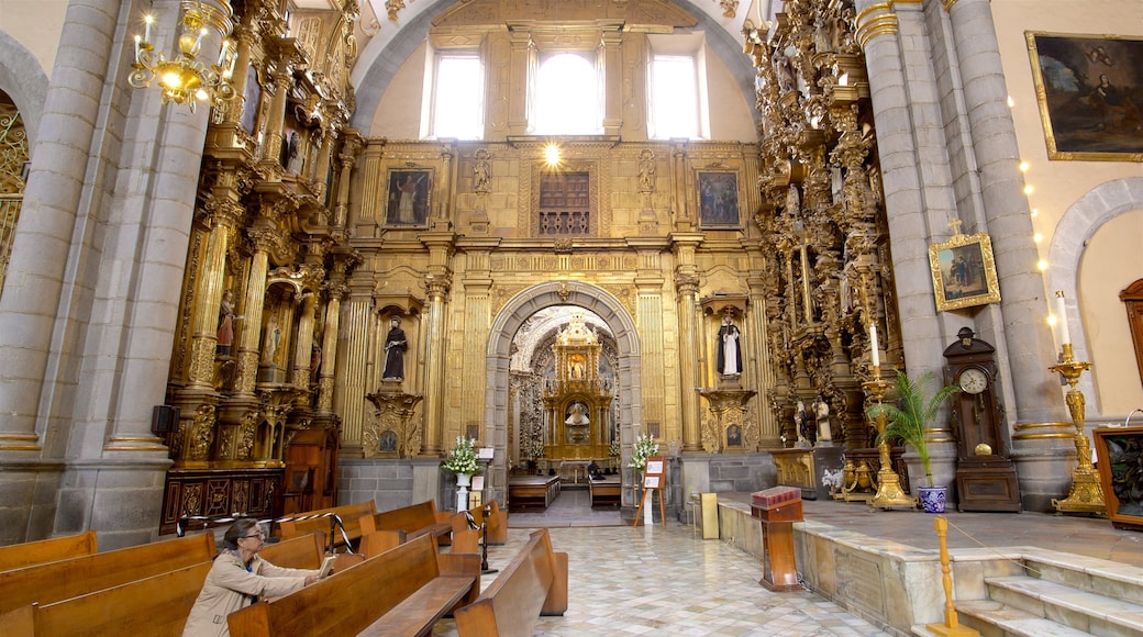 Rosario Chapel featuring a church or cathedral, heritage elements and interior views