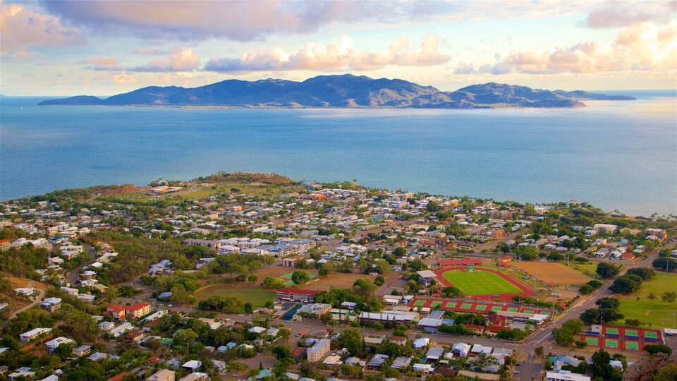 Castle Hill which includes a small town or village, a sunset and landscape views