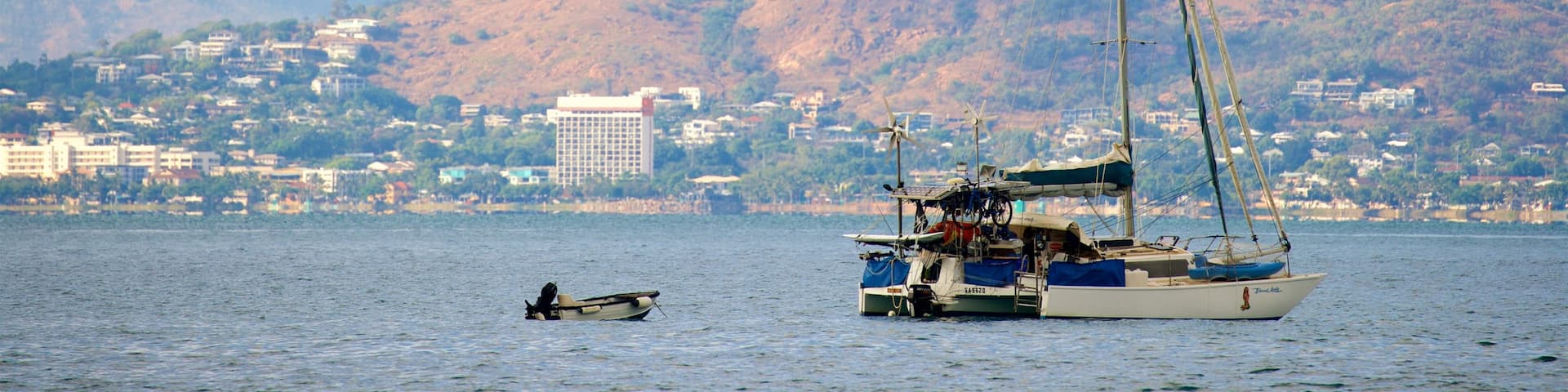 Picnic Bay which includes a small town or village, boating and tranquil scenes