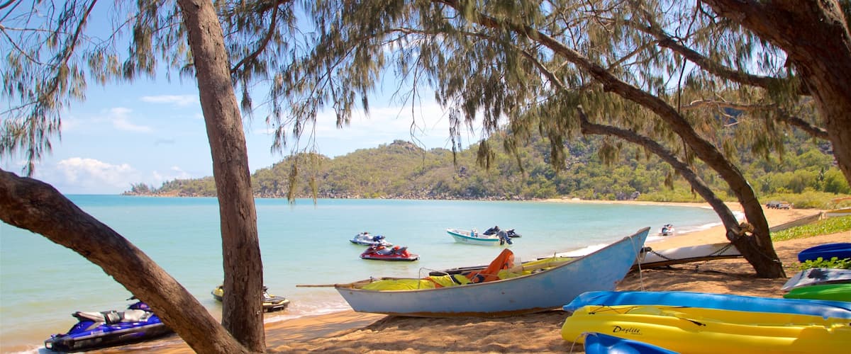 Magnetic Island which includes general coastal views, a sandy beach and jet skiing