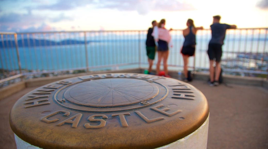 Castle Hill showing general coastal views and views as well as a small group of people