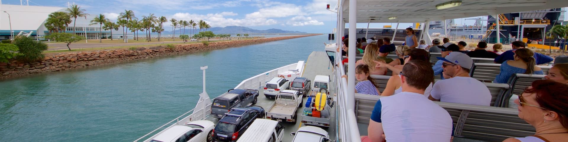 Magnetic Island Ferry Terminal featuring a ferry as well as a small group of people