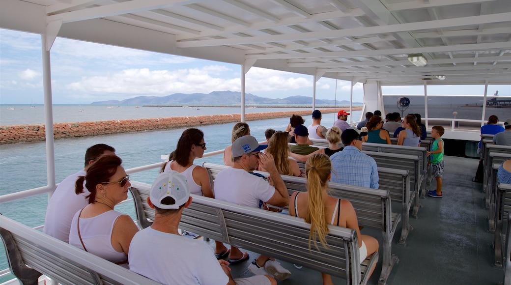 Magnetic Island Ferry Terminal showing a ferry as well as a small group of people